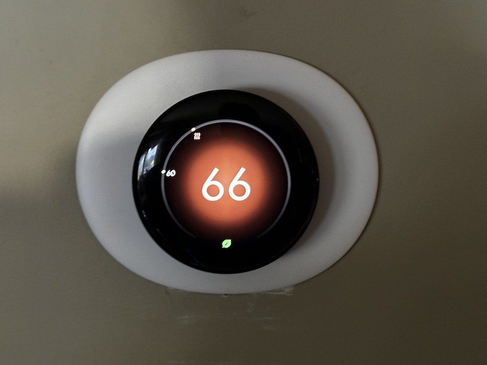 a photo of new Google Nest Learning Thermostat 4th Gen on a wall