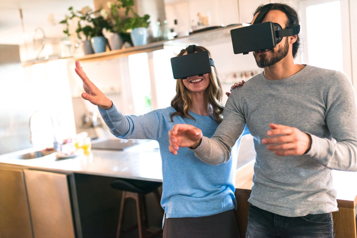 a photo of a man and woman wearing VR Headsets