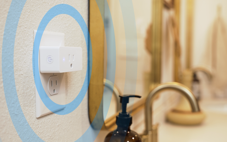 a photo of Threshold Care's Motion Wi-Fi Sensing Plugs plugged in to an outlet in a bathroom.