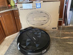  A photo of Airrobo P20 Robot Vacuum and its box on a countertop