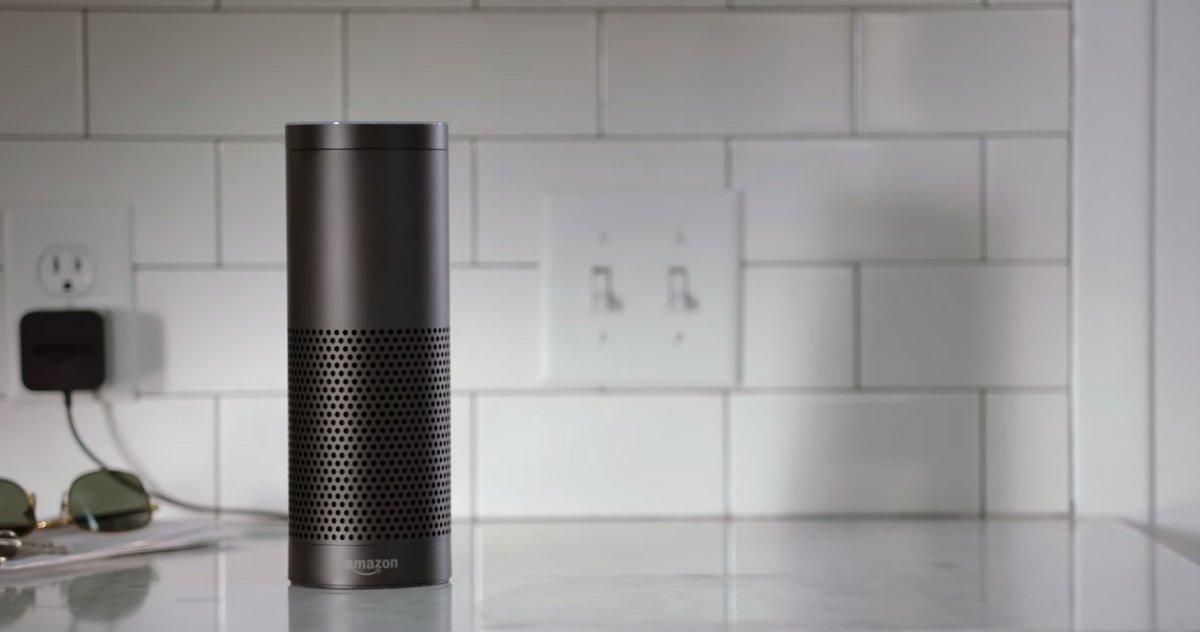 a photo of Amazon Echo 1st Gen speaker on a kitchen counter