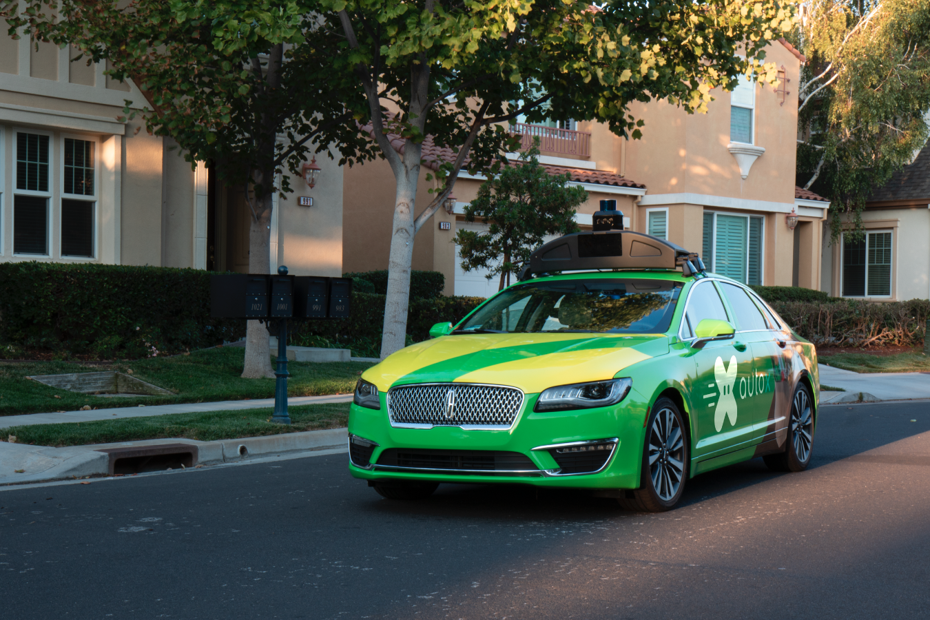 a photo of autonomous grocery vehicle on the road.