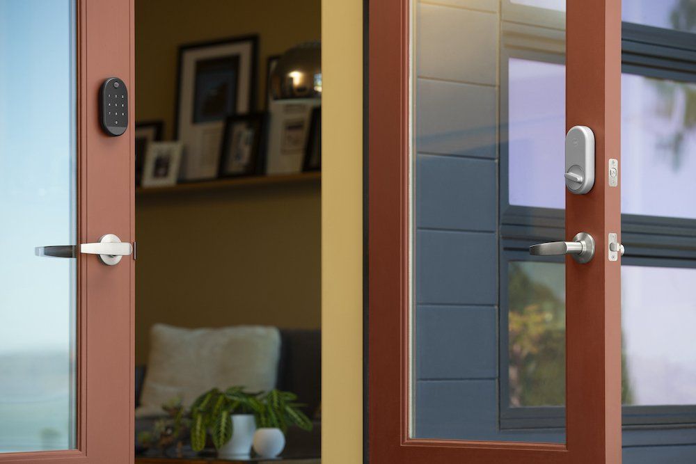 a photo of two doors open with Yale smart locks on each