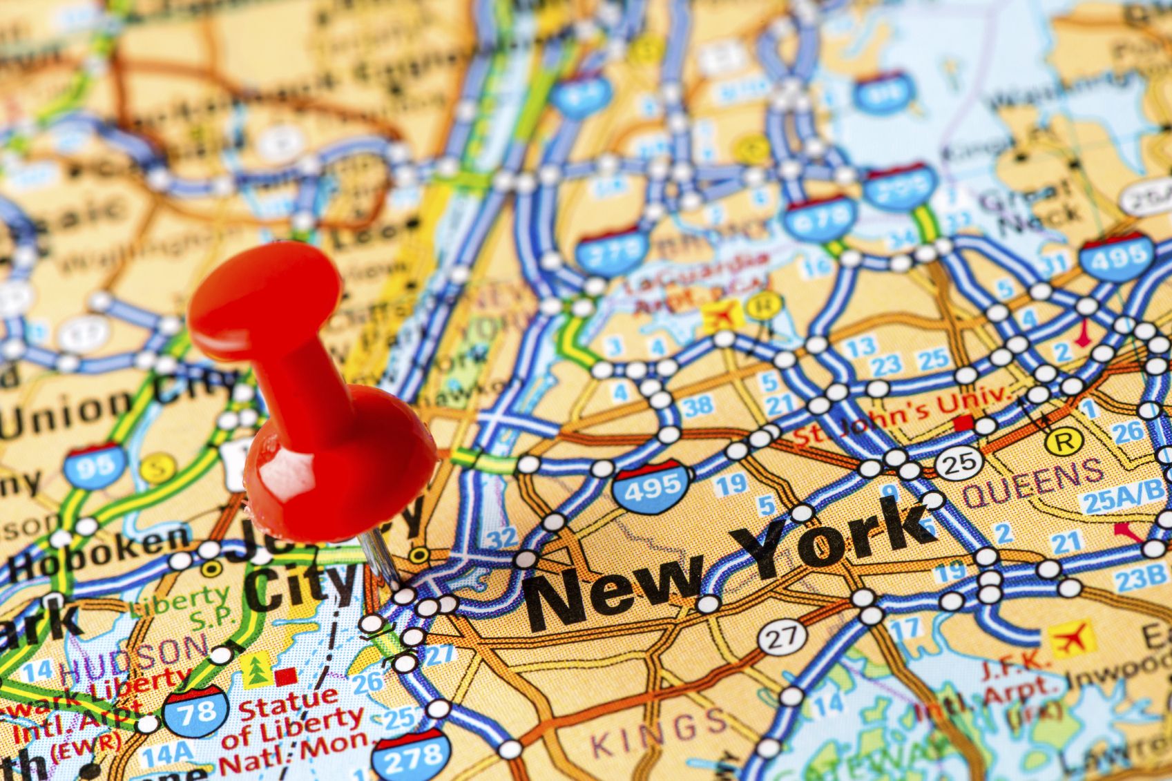 a photo of a map of NY and NJ with a red pin on NYC