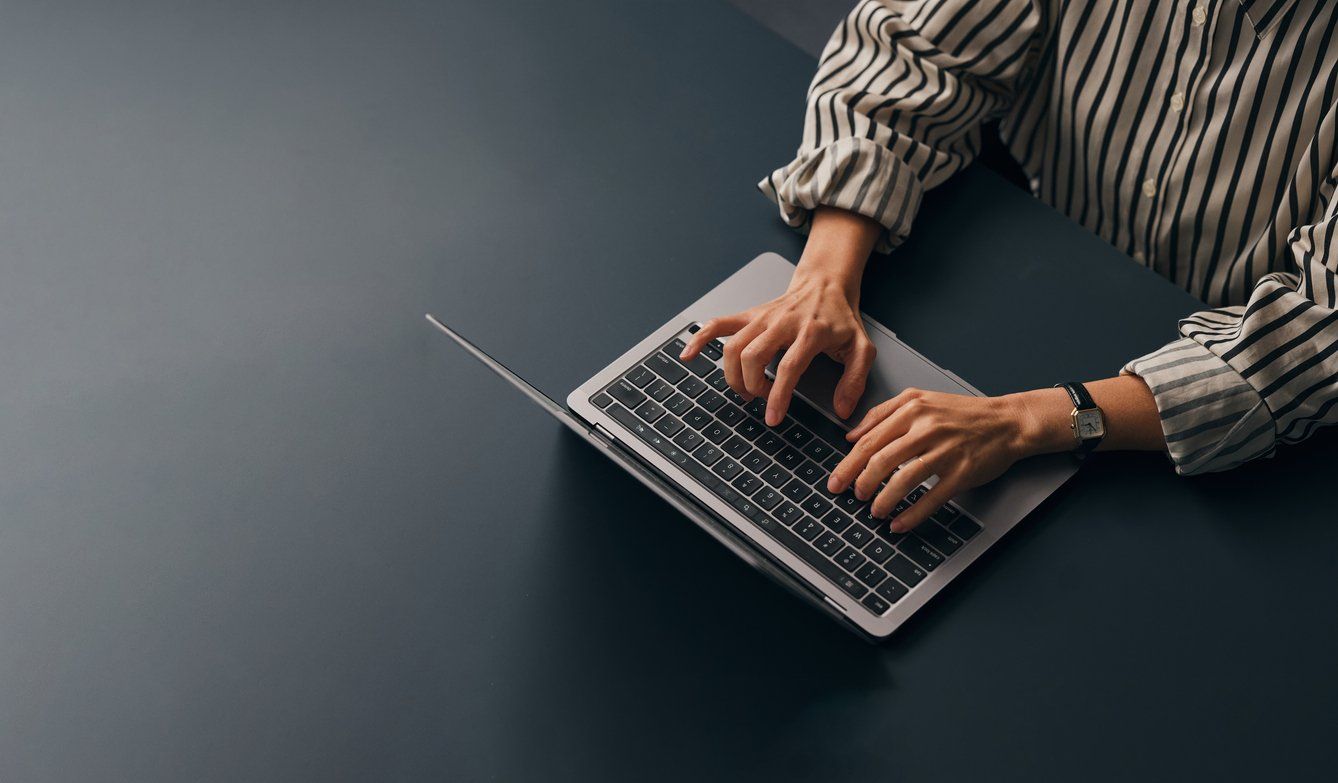 a person on a chromebook typing