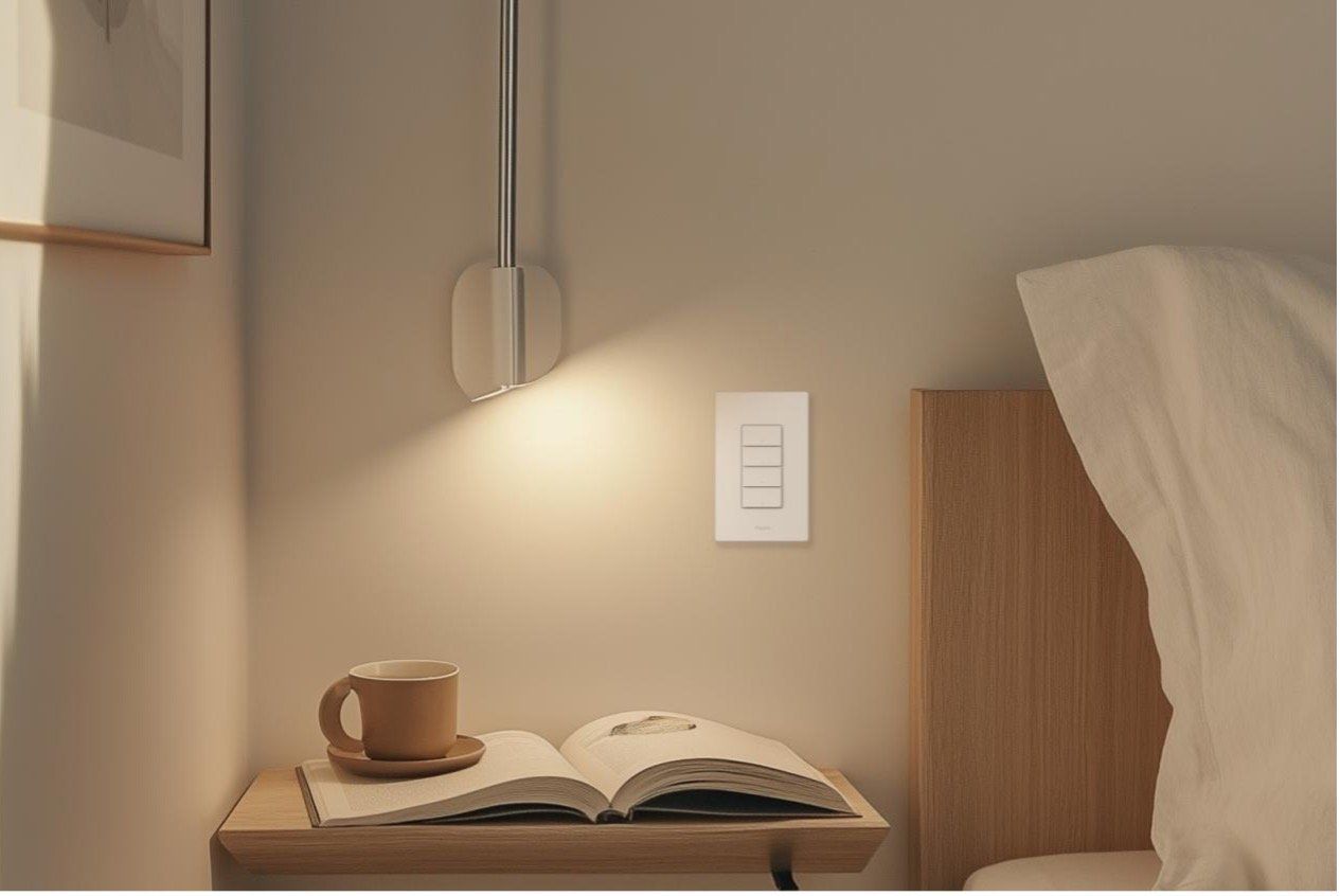 a photo of Aqara's New Light Switch H2 on a wall in a bedroom above a nightstand