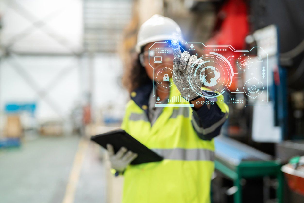 ncreasing factory standards creates confidence for consumers. Asia in refractive safety suit with personal protective equipment (PPE) standing in the production line at factory holding tablet and point to the futuristic digital graphic screen stock photo