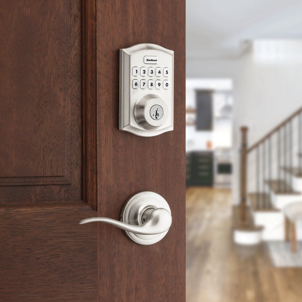 a photo of Kwikset HomeConnect 620 smart lock on a door with lever handle in Satin Chrome.