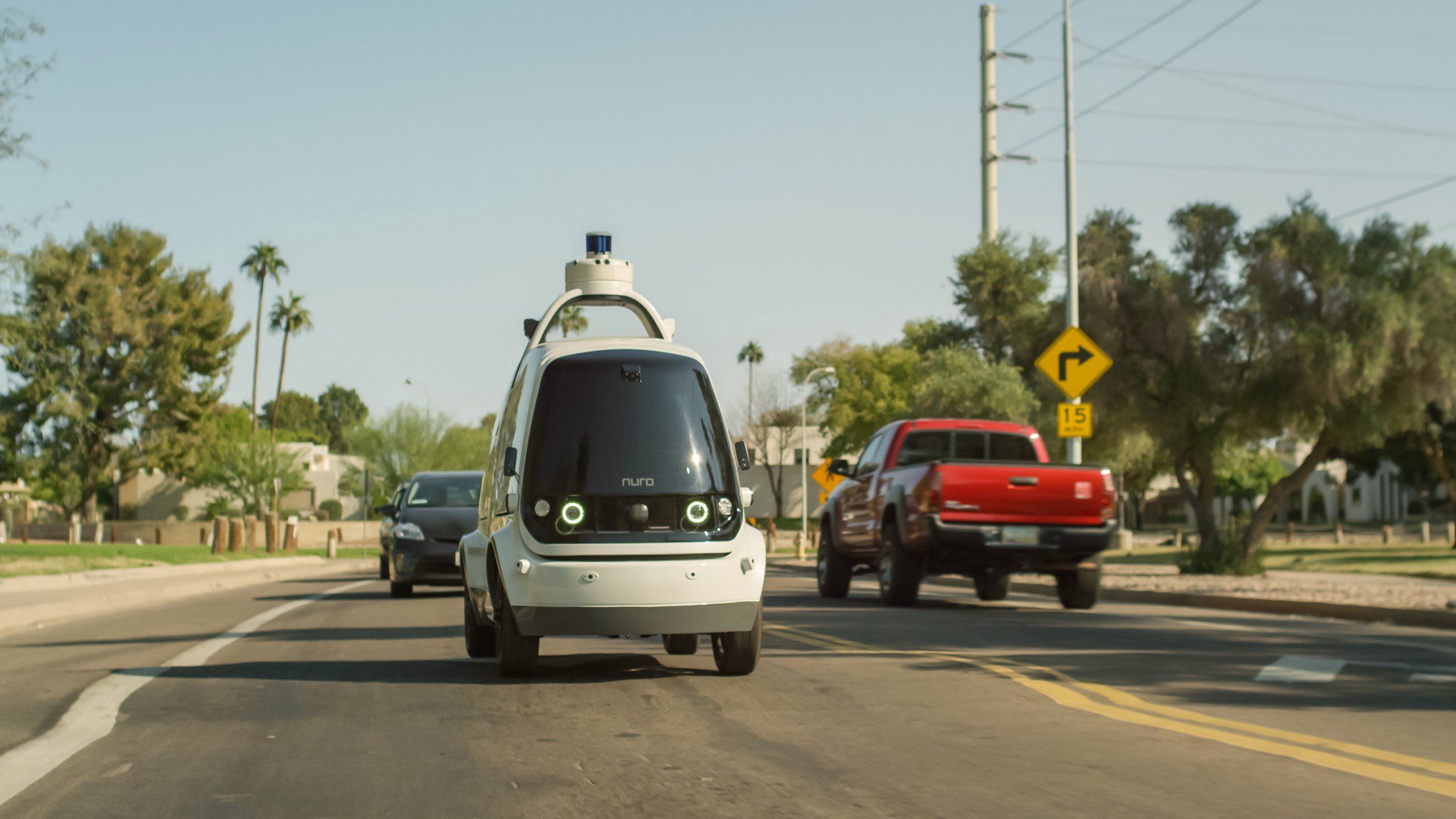 a photo of Nuro driverless vehicle on the road.