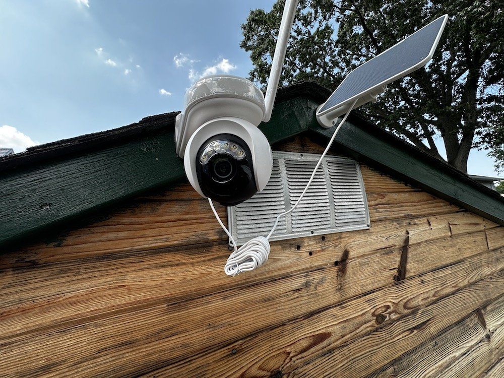 a photo of Reolink Altas PT Ultra camera installed on a shed