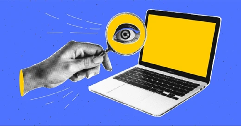 a photo of a laptop and a hand holding a magnifying glass with an eye showing.