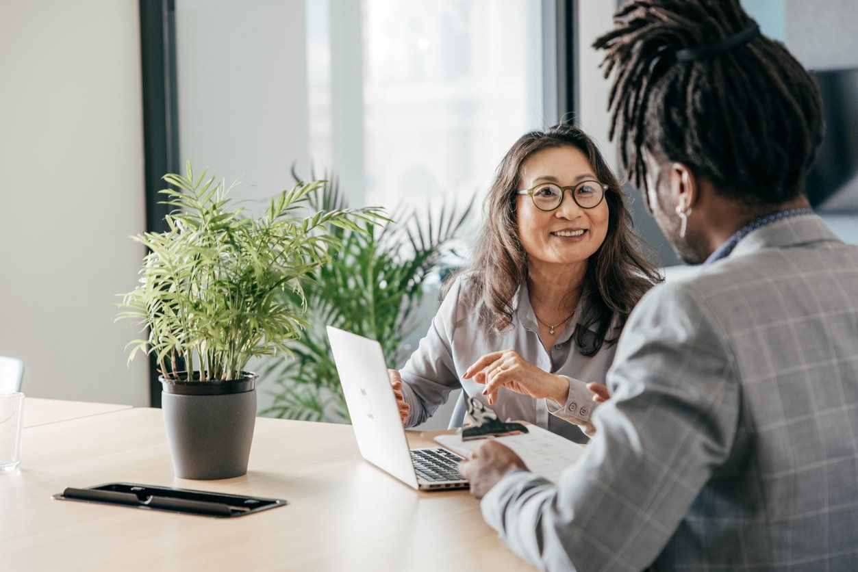 a photo of a woman tutoring another woman 