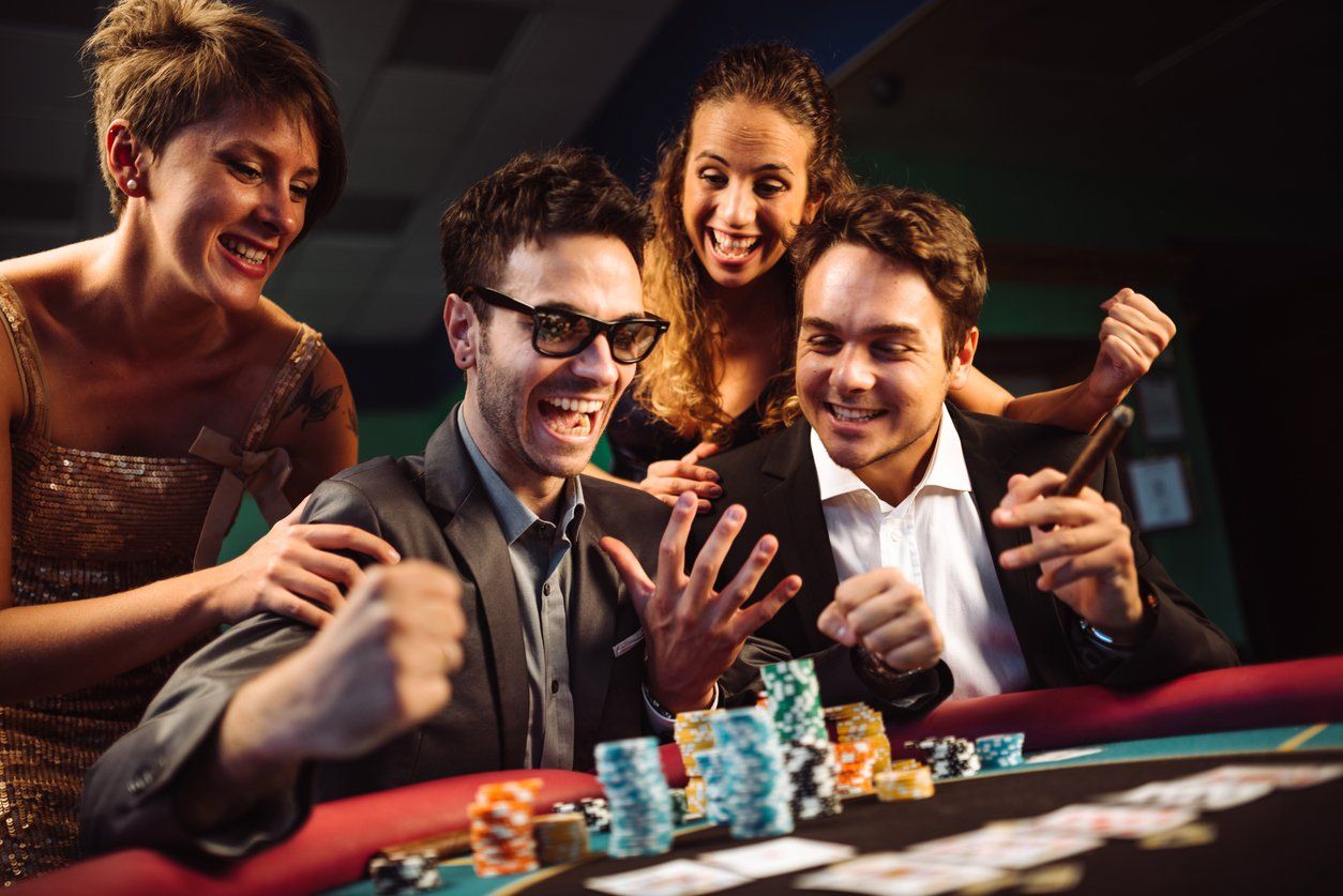 Happiness friends winning at the casino playing poker stock photo