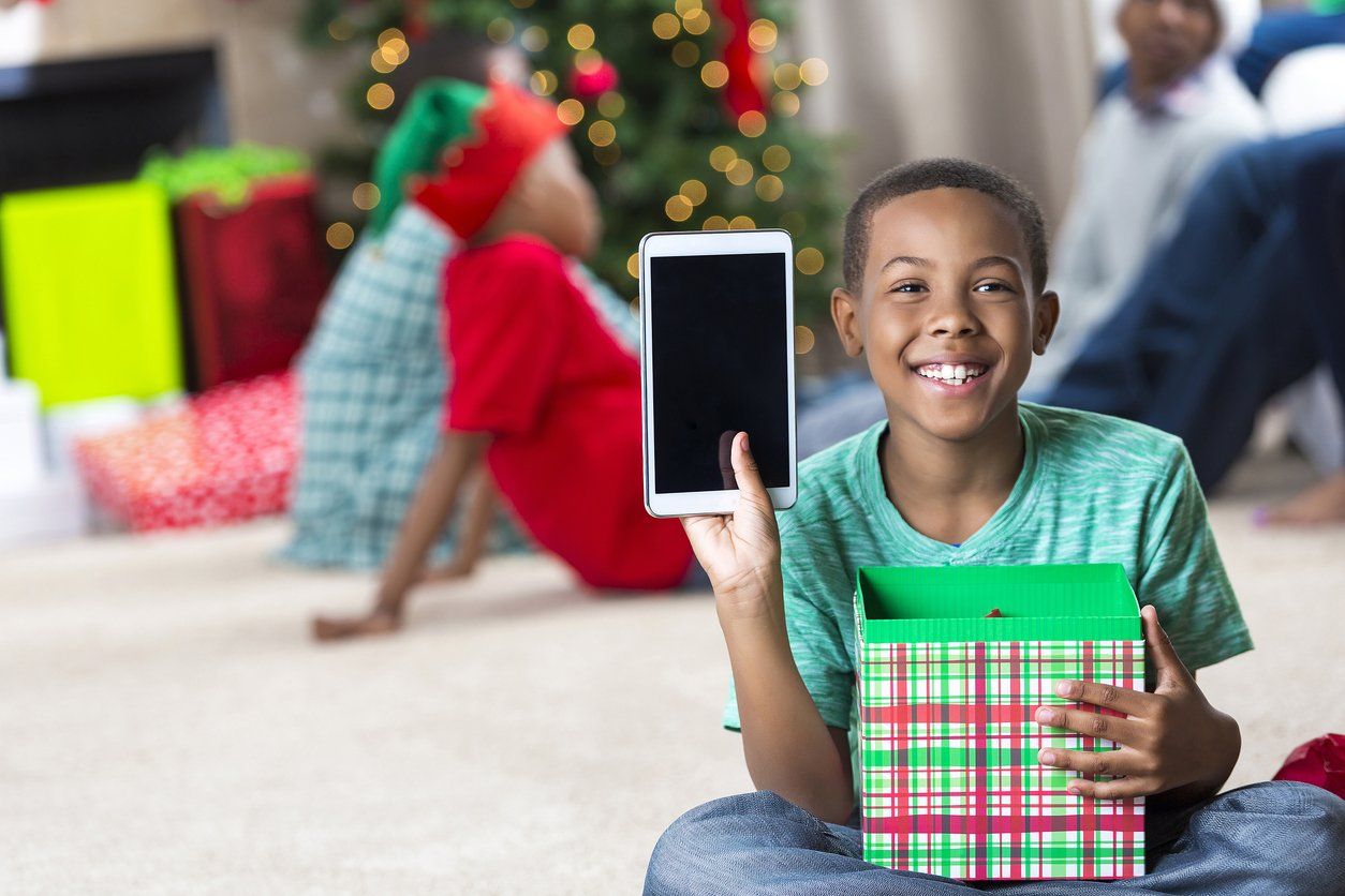 Boy shows off tablet he received at Christmastime stock photo