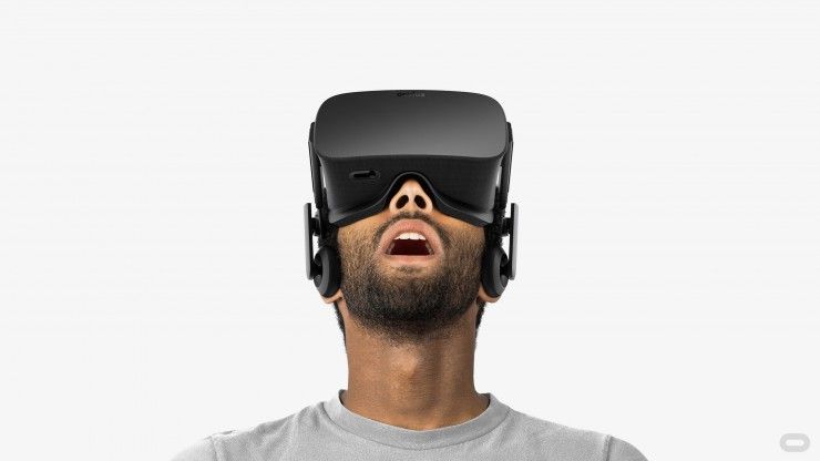 a man wearing VR headset looking up in the air photo