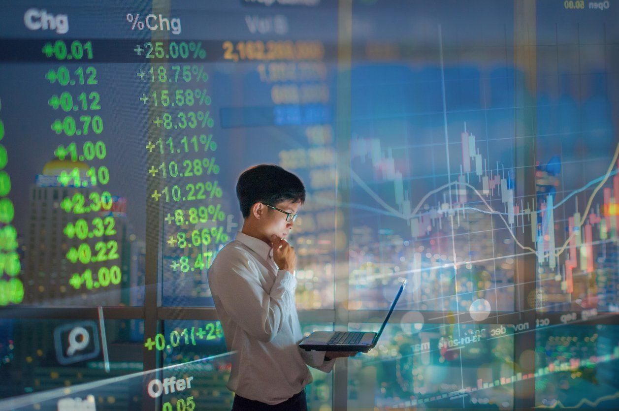 Young business man using laptop cityscape background stock photo